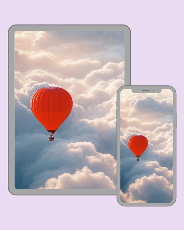 Bright red hot air balloon drifting above soft sunlit clouds