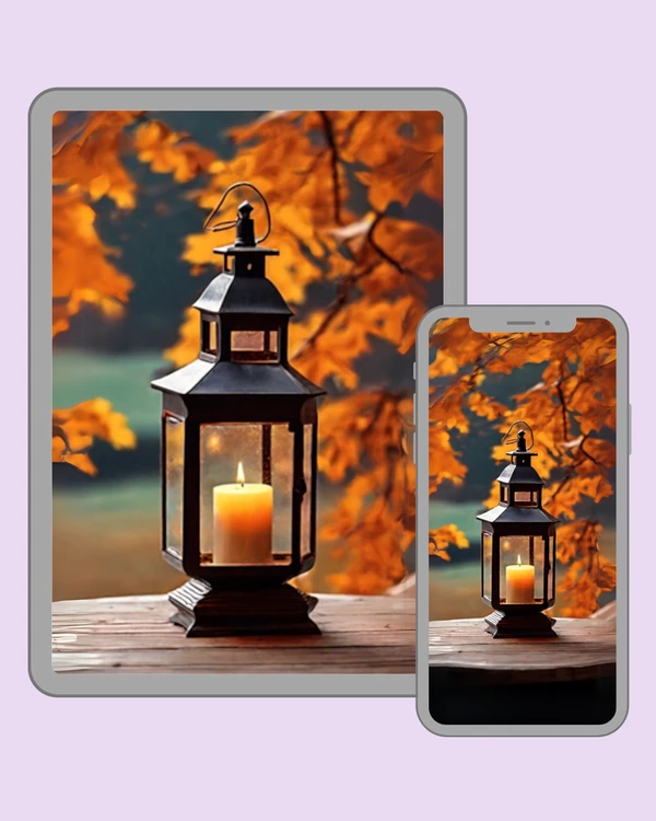 Candle lantern glowing warmly beneath vivid autumn leaves
