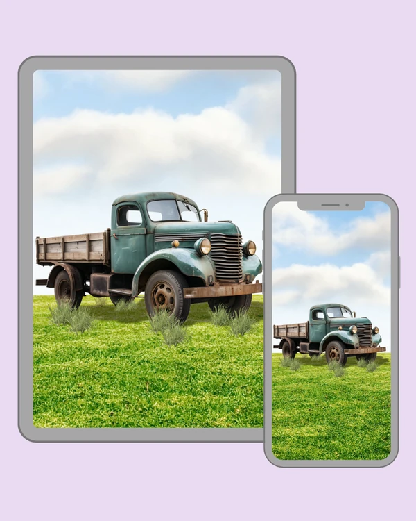 Weathered teal vintage truck resting in a bright green meadow