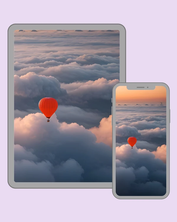 Red hot air balloon floating over a vast sea of clouds at sunset