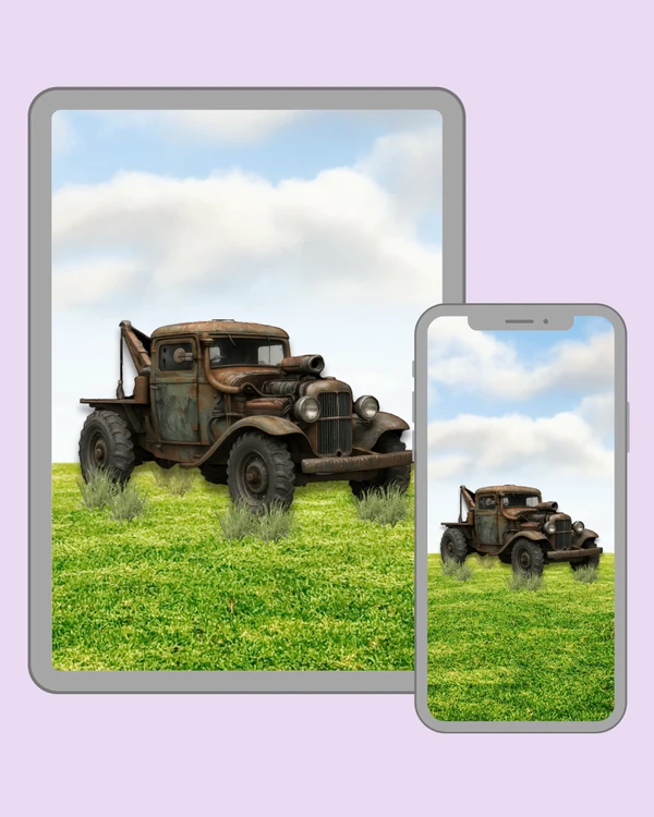 Weathered vintage tow truck standing in a sunlit green meadow