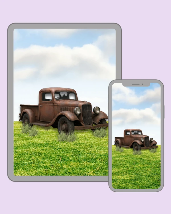 Rusty classic pickup truck resting in a bright grassy field