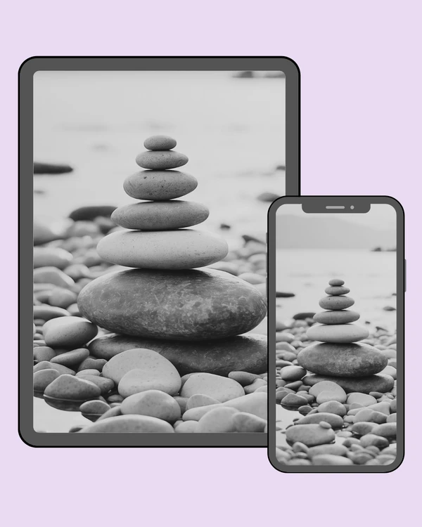 Smooth stacked pebbles resting quietly along the shoreline